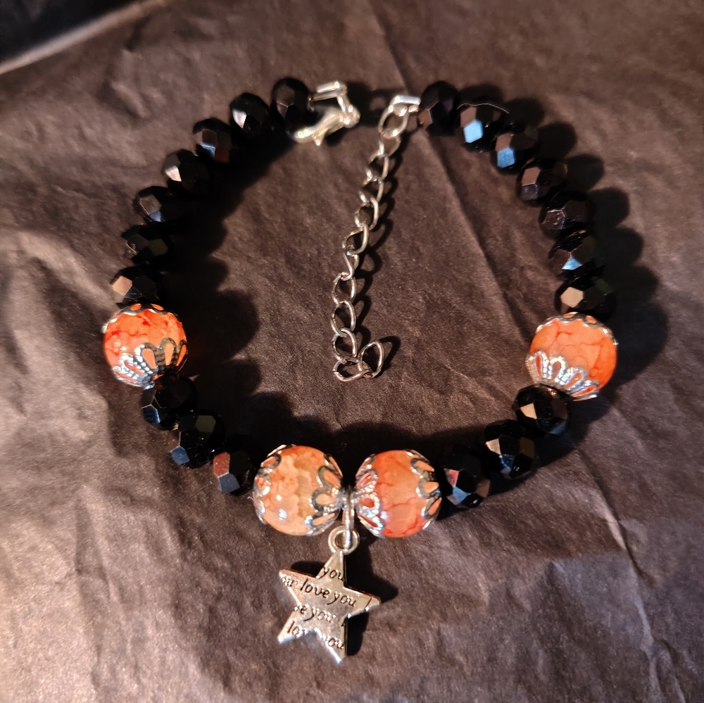 Handmade Black and Orange Glass Beaded Bracelet with Star Charm